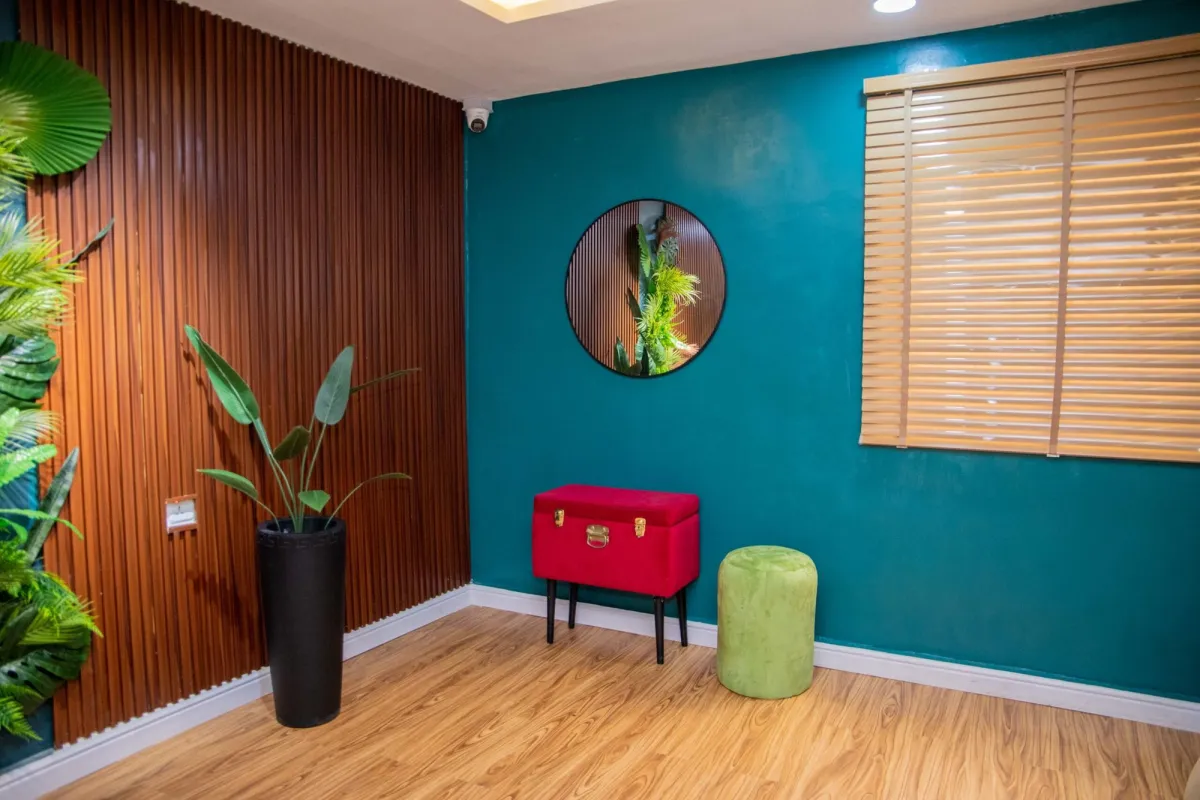 Teal wall and decor detail in the content studio