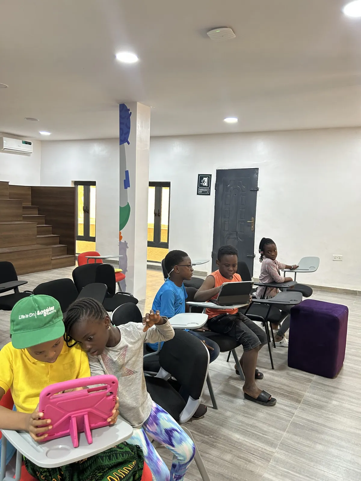 Children using tablets and laptops during a class at the EduRepublic centre